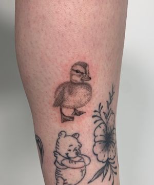 Capture the cuteness of a duckling with this stunning black and gray micro-realism tattoo by Chloe Hartland.