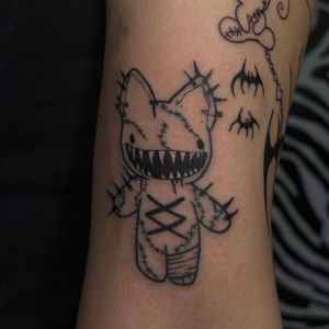 Get a unique illustrative voodoo doll tattoo by the talented artist, Zanzi La Vey. Embrace the mystical and powerful symbolism of the voodoo tradition.