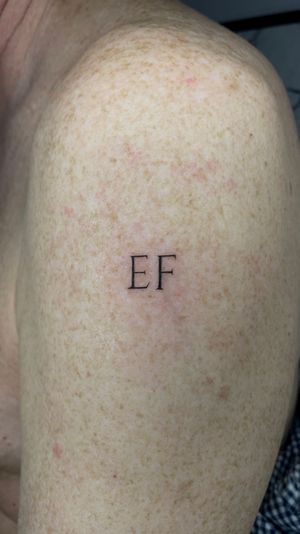 E F , Richard Curtis tattoo, fine line tattoo, italic lettering. 