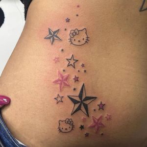 Unique illustrative tattoo featuring a nautical star design with a Hello Kitty twist, by artist Zanzi La Vey.