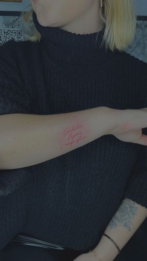 Red script fine line tattoo, red ink, script tattoo , femminine tattoo