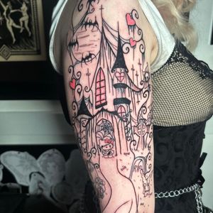 Illustrative tattoo by Zanzi La Vey featuring a spooky combination of a bat, Hello Kitty, and a haunted house motif.