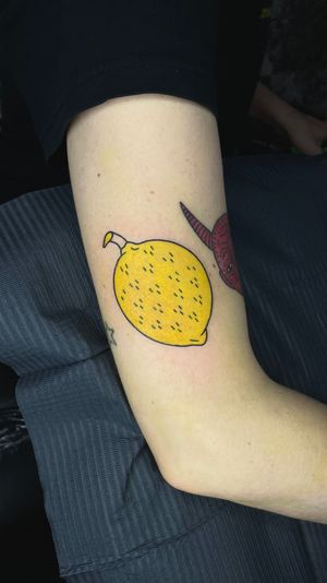 Lemon , colored tattoo. 