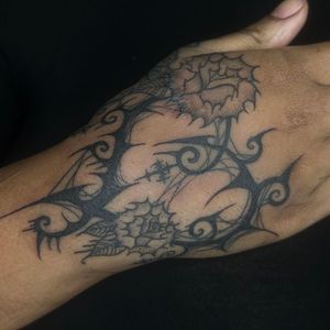 Get a unique illustrative tribal flower tattoo by Zanzi La Vey for a striking and original piece of body art.
