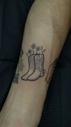Boots and plant , fine line tattoo