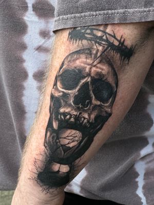Get a stunning black and gray skull tattoo done with incredible realism by the talented artist at Saka Tattoo studio.