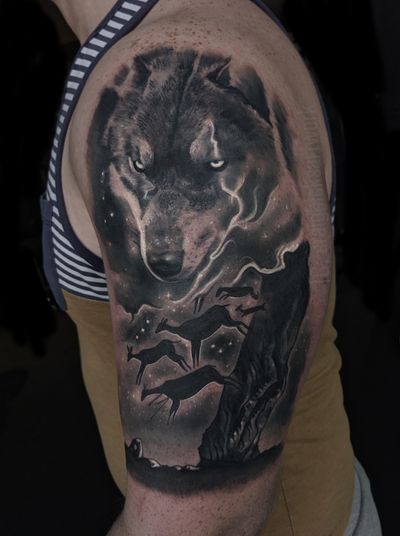 Capture the beauty of nature with this exquisite black and gray realism tattoo by Craig Hicks. Featuring a stunning deer and wolf design.