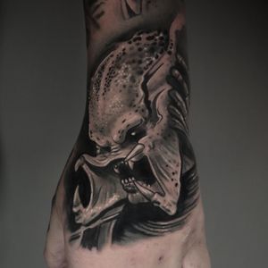 Get a fierce black & gray predator tattoo done by acclaimed artist Craig Hicks. Bring your favorite movie alien to life!
