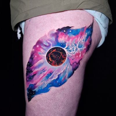 Embrace the wonders of the universe with this illustrative watercolor tattoo by Craig Hicks. Featuring a stunning galaxy and planet motif.