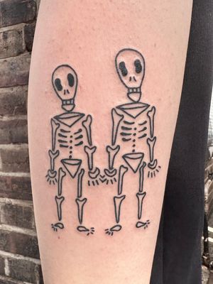 Get a bold and edgy illustrative skeleton tattoo from the talented artist Woozy Machine. Perfect for those who appreciate unique and daring ink.
