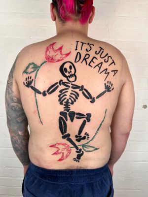 An illustrative and ignorant tattoo featuring a delicate flower intertwined with a skeleton, designed by the talented artist Woozy Machine.