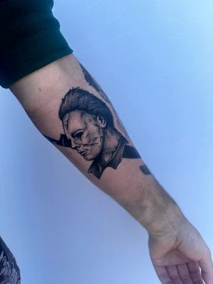Capture the iconic terror of Michael Myers with this black and gray realism tattoo by Miss Vampira.