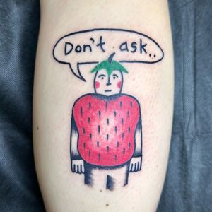 Ignorant illustrative comic tattoo featuring a man with a strawberry motif by Woozy Machine
