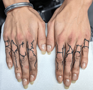 Small lettering tattoo in blackwork style by Adam McDade. Simple yet impactful design.