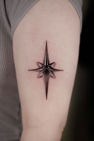 Experience the sleek and metallic beauty of chrome with this black and gray micro realism tattoo by the talented artist Gloria Gu.