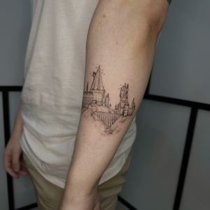 Experience the beauty of architecture with this stunning black and gray illustrative tattoo by Tas Kal.