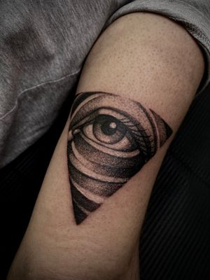 Get mesmerized by this captivating blackwork and dotwork eye design by Lamat, perfect for those seeking a unique and detailed tattoo.