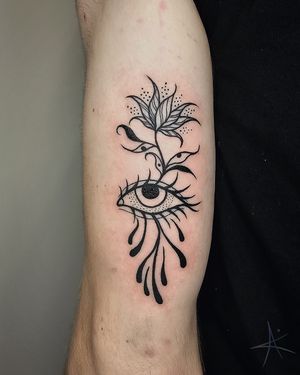 Get mesmerized by this abstract blackwork illustration of a flower and eye by AmaaNitaa.