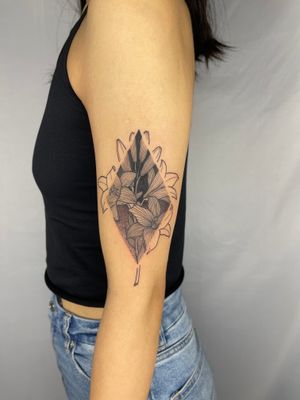 Intricately detailed floral tattoo by Wade Barnes using dotwork and fine line techniques.