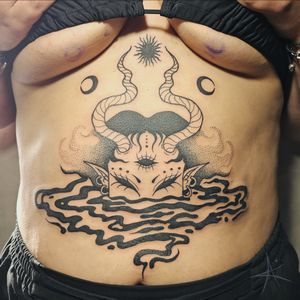 Explore the depths of darkness with this striking blackwork tattoo featuring a sinister water demon and a mysterious woman. Done with intricate dotwork and illustrative style by AmaaNitaa.
