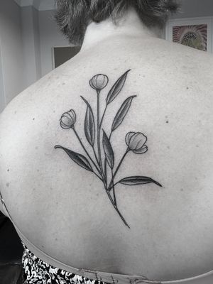 Embrace nature with a stunning illustrative flower tattoo by renowned artist Oliver Whiting. This intricate design will be a beautiful addition to your body art collection.