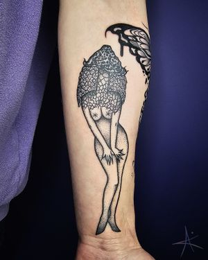 A captivating blackwork and dotwork design featuring a woman and a magical mushroom, expertly crafted by AmaaNitaa.