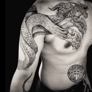 Embrace the power of the triple threat. 🐉🔥 Unleash the ferocity, wisdom, and majesty of the three-headed dragon with this breathtaking tattoo masterpiece.