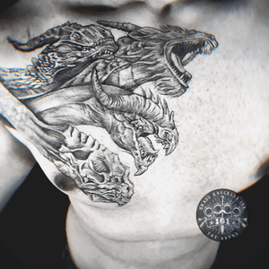 Embrace the power of the triple threat. 🐉🔥 Unleash the ferocity, wisdom, and majesty of the three-headed dragon with this breathtaking tattoo masterpiece. #TripleThreat #DragonTattoo