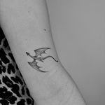 Experience the power and beauty of a Ruth Hall illustrative dragon tattoo. Unleash your inner strength with this stunning design.