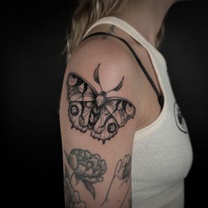 Capture the mystique of the night with this stunning illustrative moth tattoo by talented artist Jenny Dubet.