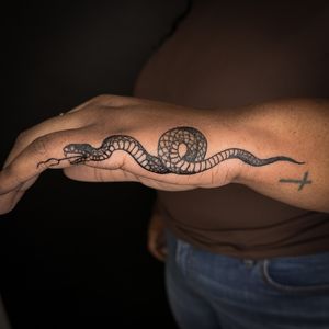 Embrace the mysterious allure of a striking illustrative snake tattoo by the talented artist Jenny Dubet. Let the serpent symbolize transformation and rebirth on your skin.