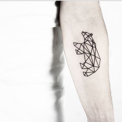 Admire the intricate lines and shapes in this stunning bear tattoo by Malvina Maria Wisniewska. A unique blend of fine lines and geometric patterns create a striking and modern design.