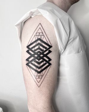 Discover the intricate and mesmerizing design of this blackwork tattoo by Malvina Maria Wisniewska, featuring fine lines and geometric shapes.