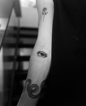 Experience the intricate detailing in this black and gray eye tattoo by Georgina. A stunning piece of art on your skin.