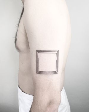 Elegant fine line tattoo featuring a geometric frame design, crafted by the talented artist Malvina Maria Wisniewska.