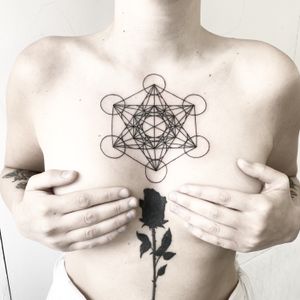 Discover the intricate beauty of this fine line geometric pattern tattoo by talented artist Malvina Maria Wisniewska.