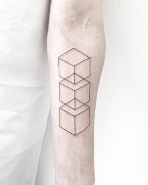 Explore the intricate beauty of this fine line geometric cube tattoo by Malvina Maria Wisniewska. A mesmerizing piece of art for your body!