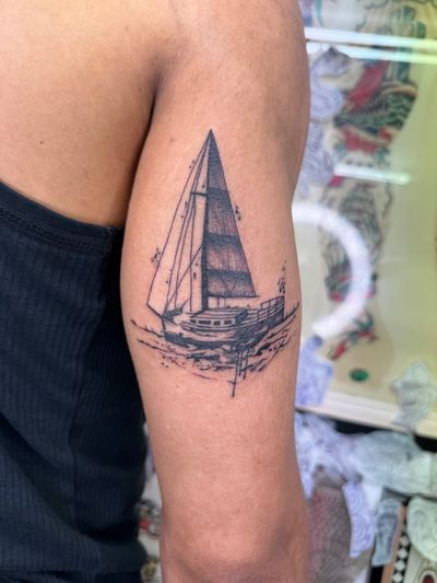 Sail away with this stunning illustrative ship tattoo by renowned artist Ryan Goodrum. Perfect for those who love the sea and adventure.