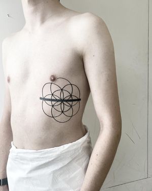 Elegant fine line tattoo by Malvina Maria Wisniewska, featuring a mesmerizing geometric pattern.