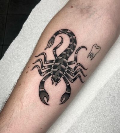 Get inked with a bold and iconic traditional scorpion design by the talented artist, Ryan Goodrum.