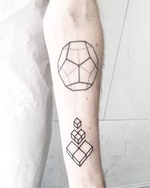 Experience the bold and precise artistry of this geometric solid tattoo by renowned artist Malvina Maria Wisniewska.