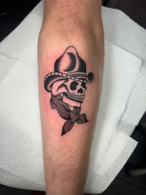Get epic vibes with this traditional tattoo featuring a skull cowboy by Ryan Goodrum. Perfect for Western enthusiasts!