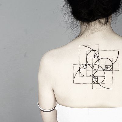 Experience the perfection of the golden ratio in this unique and intricate tattoo by Malvina Maria Wisniewska.