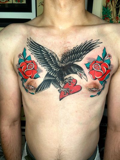 Get a striking traditional tattoo featuring a crow, rose, and heart designed by the talented artist Ryan Goodrum.