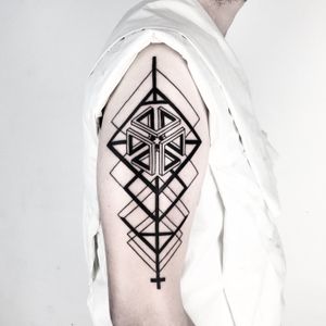 Unique and intricate blackwork tattoo featuring geometric patterns, done by Malvina Maria Wisniewska.