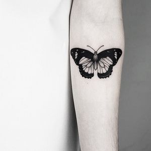 Discover the intricate beauty of this illustrative butterfly tattoo by the talented Malvina Maria Wisniewska.