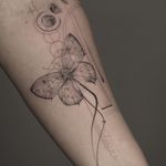Beautiful black and gray fine line tattoo by Kayla featuring a geometric design with a moon and butterfly motif.