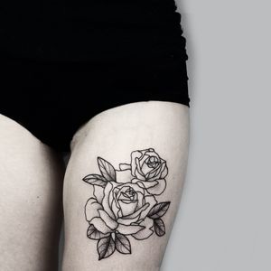 Graceful fine line and illustrative flower tattoo by Malvina Maria Wisniewska, capturing the essence of nature's beauty.