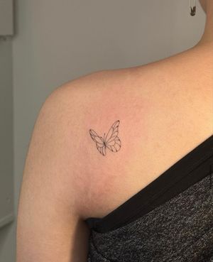 Experience the beauty of nature with this intricate fine line butterfly tattoo by Amelia. Delicately designed to capture the essence of freedom and beauty.