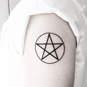 Unique blackwork tattoo design featuring a combination of stars, circles, and pentagrams. Created by talented artist Malvina Maria Wisniewska.